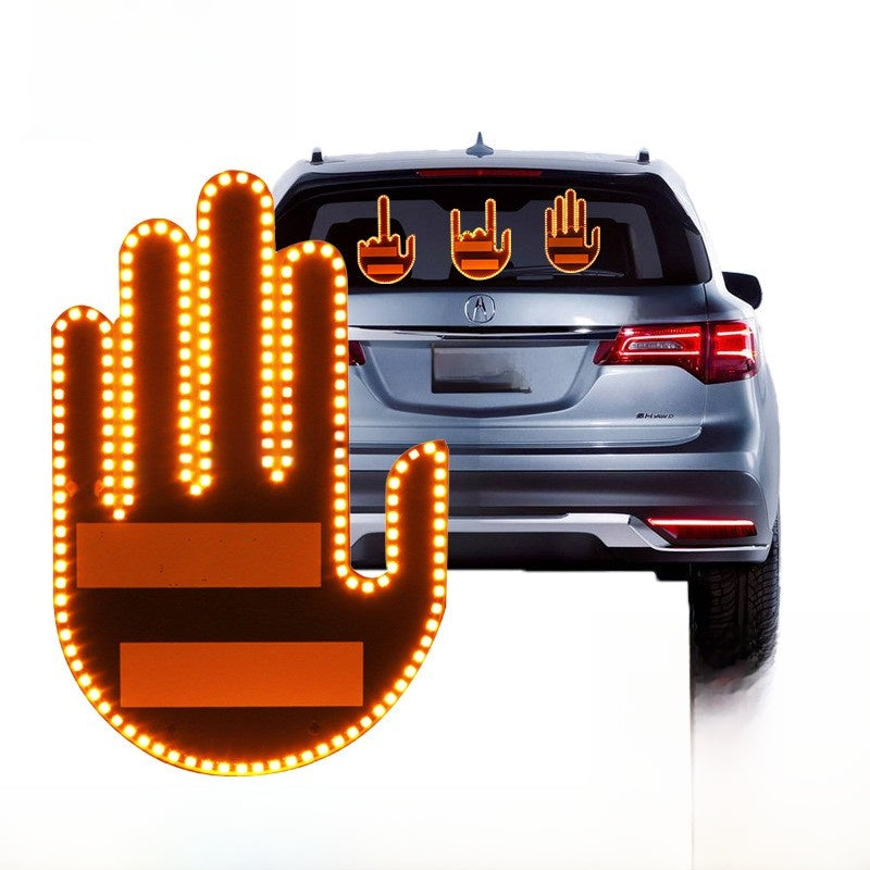 Apex GestureGlow LED hand gesture light lit amber, shown on an SUV rear window