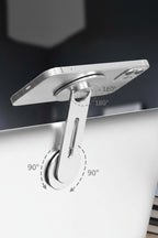 Phone holder attached to a laptop with angle measurement indicators on a dark background