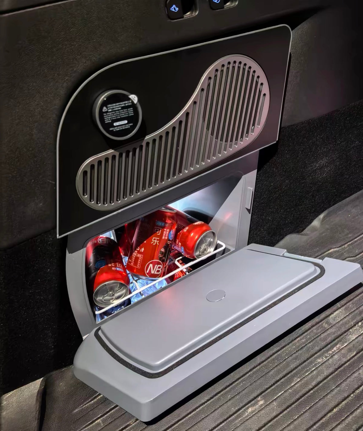 Drawer open, LED lit, cans inside