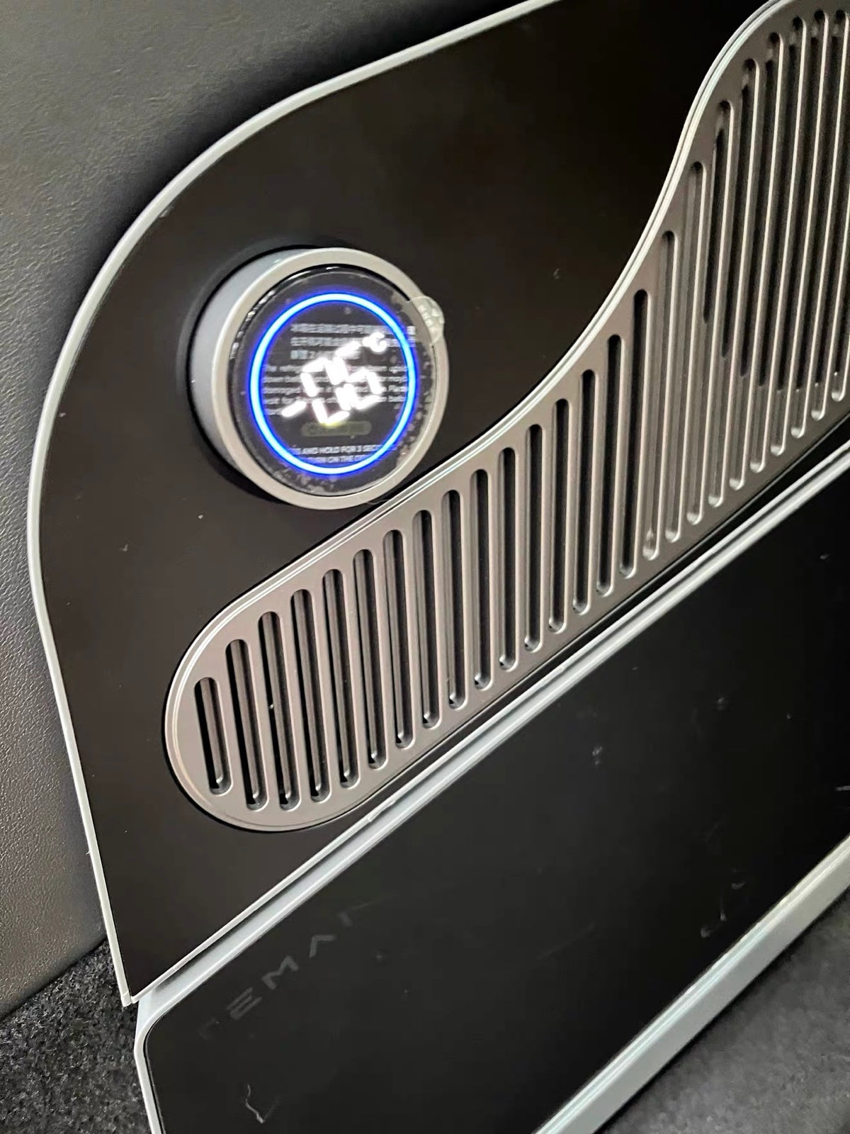 Illuminated dial and brushed grille