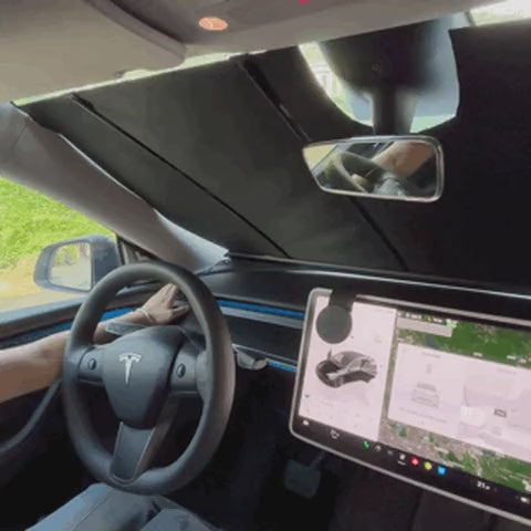 Apex AutoShade Pro electric windshield sunshade deploying inside a Tesla Model 3